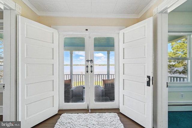 doorway to outside with ornamental molding, dark wood-style floors, and french doors