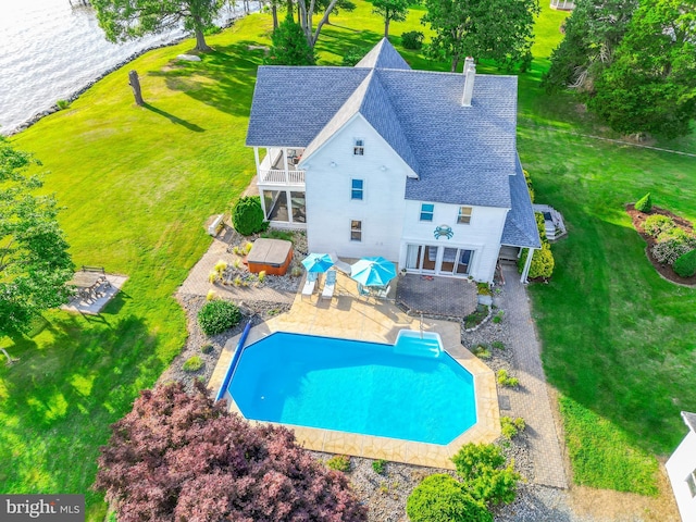pool with a yard, a deck, and a fenced backyard