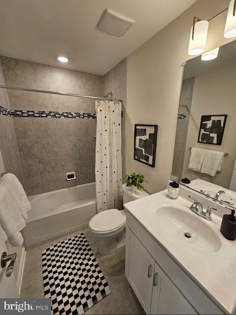 7304 Roxy Run, Clinton, MD 20735 - full bathroom with visible vents, vanity, toilet, tile patterned floors, and shower / tub combo