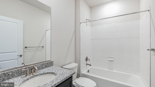 bathroom with toilet, bathing tub / shower combination, and vanity