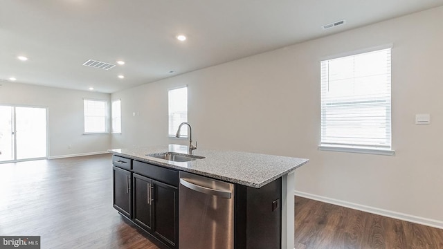 kitchen with a sink, stainless steel dishwasher, dark wood finished floors, and visible vents