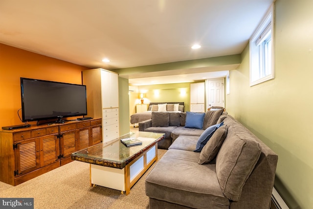 living area with a baseboard radiator, recessed lighting, and carpet floors