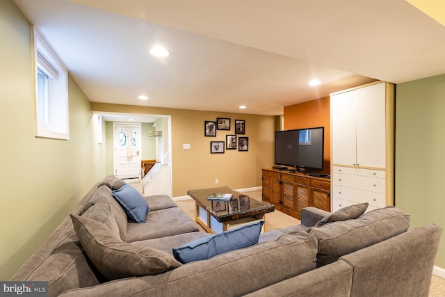 carpeted living area featuring baseboards and recessed lighting