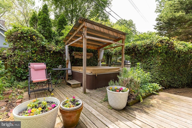deck featuring a hot tub