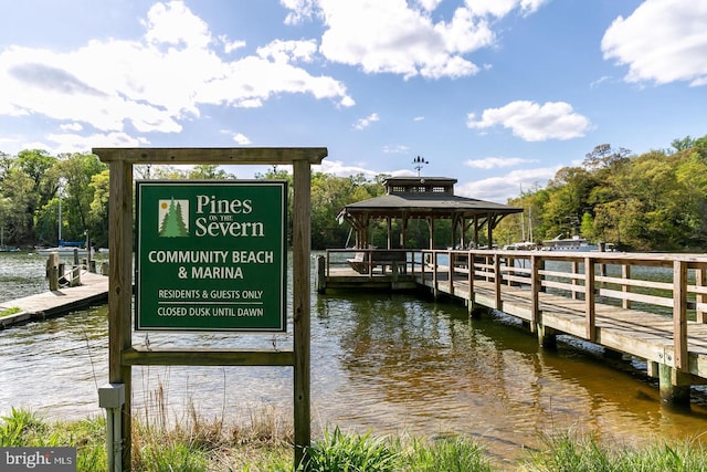 dock area with a water view and a gazebo