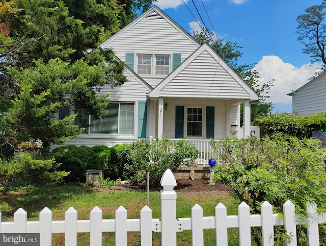 412 Linda Ave, Linthicum Heights, MD 21090 - bungalow with a porch and a fenced front yard