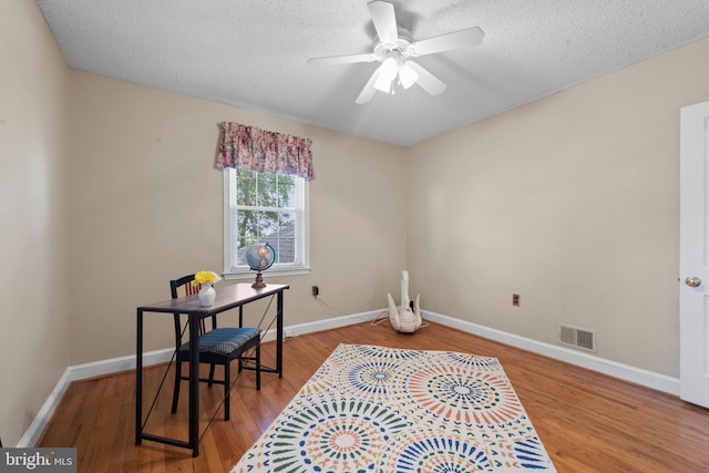 412 Linda Ave, Linthicum Heights, MD 21090 - office space with wood finished floors, a ceiling fan, a textured ceiling, and baseboards