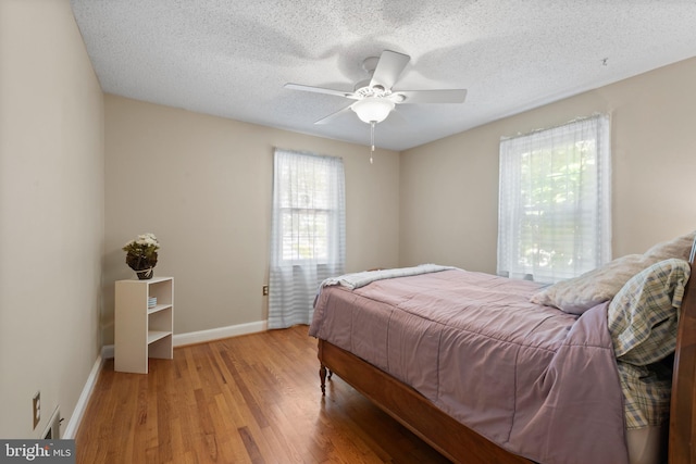 412 Linda Ave, Linthicum Heights, MD 21090 - bedroom with light wood-type flooring, baseboards, a textured ceiling, and a ceiling fan