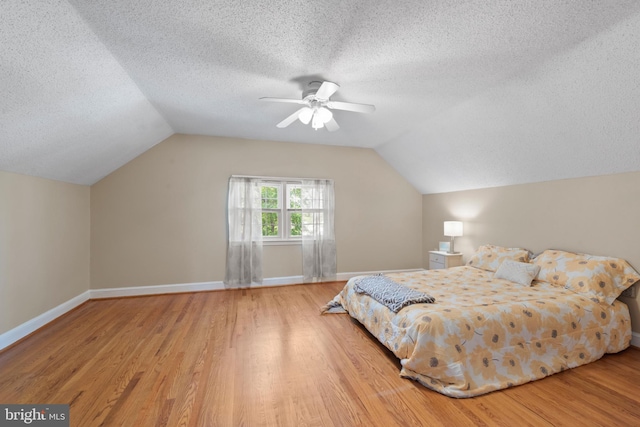 412 Linda Ave, Linthicum Heights, MD 21090 - bedroom featuring wood finished floors, a textured ceiling, lofted ceiling, a ceiling fan, and baseboards