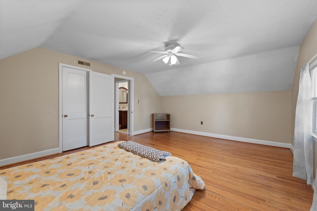 412 Linda Ave, Linthicum Heights, MD 21090 - bedroom with vaulted ceiling, wood finished floors, baseboards, ceiling fan, and a textured ceiling