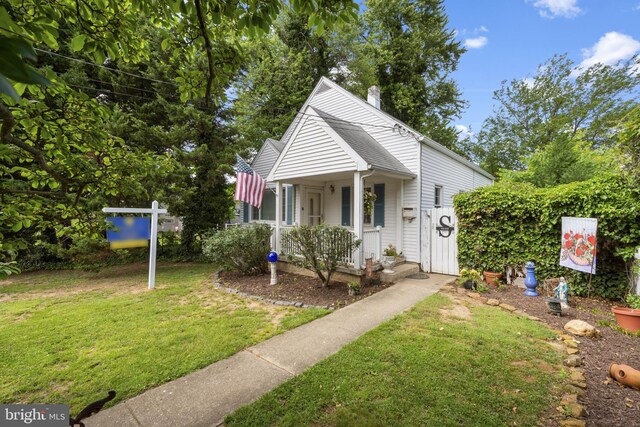 412 Linda Ave, Linthicum Heights, MD 21090 - view of front of home with a front yard and a porch