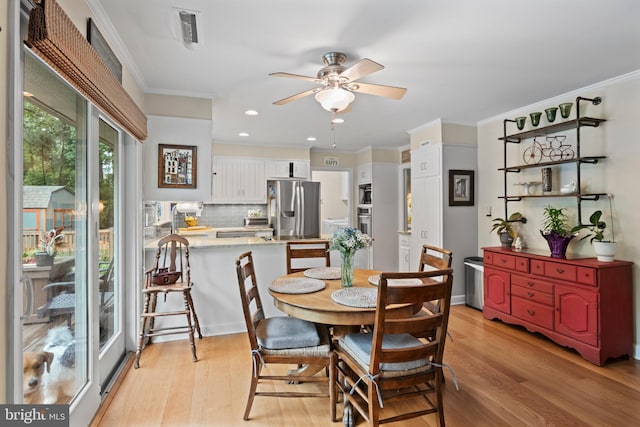 8543 Ingleton Rd, Easton, MD 21601 - dining space featuring light wood-style floors, a ceiling fan, crown molding, and recessed lighting