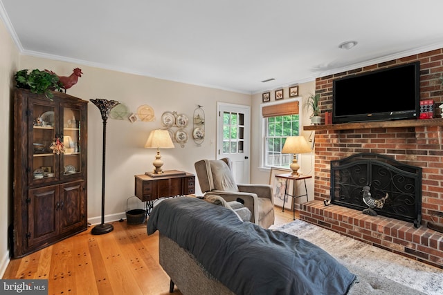 8543 Ingleton Rd, Easton, MD 21601 - living area with light wood-style flooring, crown molding, a brick fireplace, and baseboards