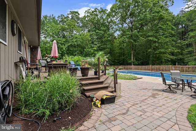 8543 Ingleton Rd, Easton, MD 21601 - view of patio / terrace featuring outdoor dining space, a wooden deck, fence, and view of wooded area