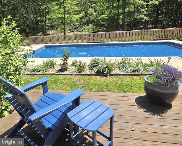 8543 Ingleton Rd, Easton, MD 21601 - view of swimming pool featuring a wooden deck and fence