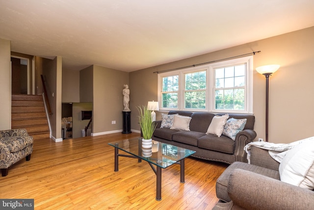4537 Kavan Ct, Doylestown, PA 18902 - living room with light wood finished floors, baseboards, and stairway