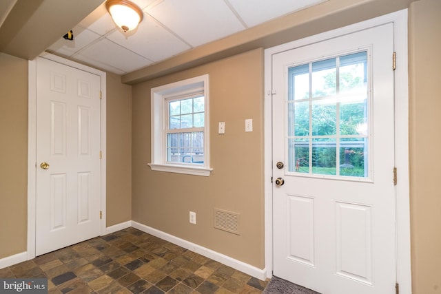 4537 Kavan Ct, Doylestown, PA 18902 - doorway featuring baseboards, dark stone finish floors, and a drop ceiling