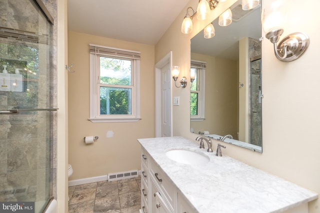 4537 Kavan Ct, Doylestown, PA 18902 - full bath with baseboards, a shower with shower door, vanity, toilet, and stone finish floors