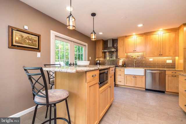 4537 Kavan Ct, Doylestown, PA 18902 - kitchen with stainless steel appliances, wall chimney exhaust hood, a breakfast bar area, light brown cabinetry, and decorative backsplash