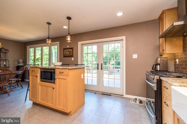 4537 Kavan Ct, Doylestown, PA 18902 - kitchen with stainless steel appliances, wall chimney range hood, french doors, backsplash, and light stone counters