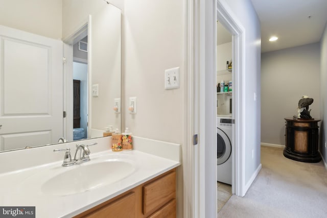 bathroom featuring washer / clothes dryer, recessed lighting, and vanity