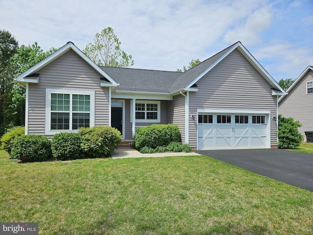 single story home featuring a garage, driveway, roof with shingles, and a front yard