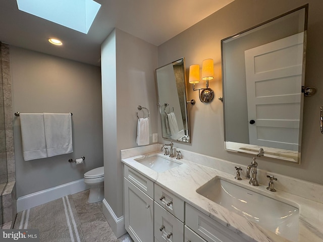 3612 S St NW, Washington, DC 20007 - full bath with a sink, double vanity, a skylight, and toilet