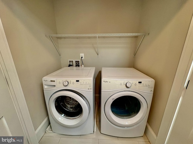 3612 S St NW, Washington, DC 20007 - laundry area featuring laundry area, washer and clothes dryer, baseboards, and light tile patterned floors