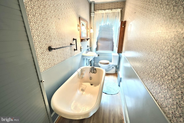 1492 Leonard St, York, PA 17404 - bathroom featuring wood finished floors, toilet, a sink, and a tub