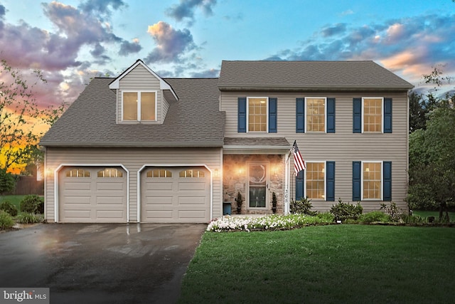 365 Apple Tree Ln, Mount Wolf, PA 17347 - view of front facade featuring asphalt driveway, a front lawn, a garage, and a shingled roof