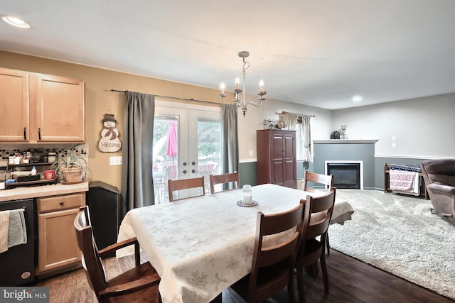 365 Apple Tree Ln, Mount Wolf, PA 17347 - dining area with french doors, dark wood-style flooring, a glass covered fireplace, recessed lighting, and a chandelier