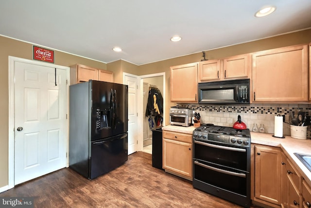 365 Apple Tree Ln, Mount Wolf, PA 17347 - kitchen with black appliances, light brown cabinets, light countertops, backsplash, and dark wood finished floors