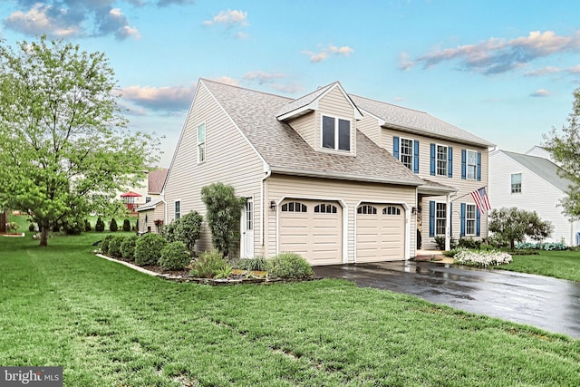 365 Apple Tree Ln, Mount Wolf, PA 17347 - view of front of property featuring driveway, roof with shingles, a front lawn, and a garage