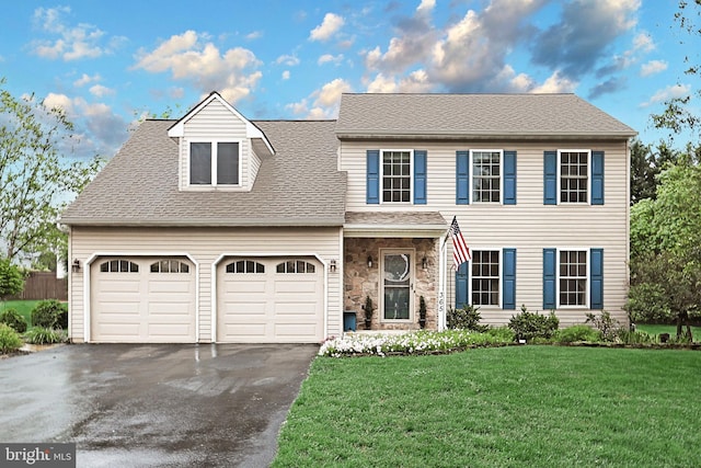 365 Apple Tree Ln, Mount Wolf, PA 17347 - view of front facade with asphalt driveway, a front lawn, roof with shingles, and stone siding