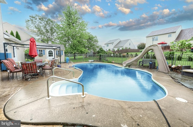 365 Apple Tree Ln, Mount Wolf, PA 17347 - view of pool with a water slide, a patio, an outdoor structure, and a residential view