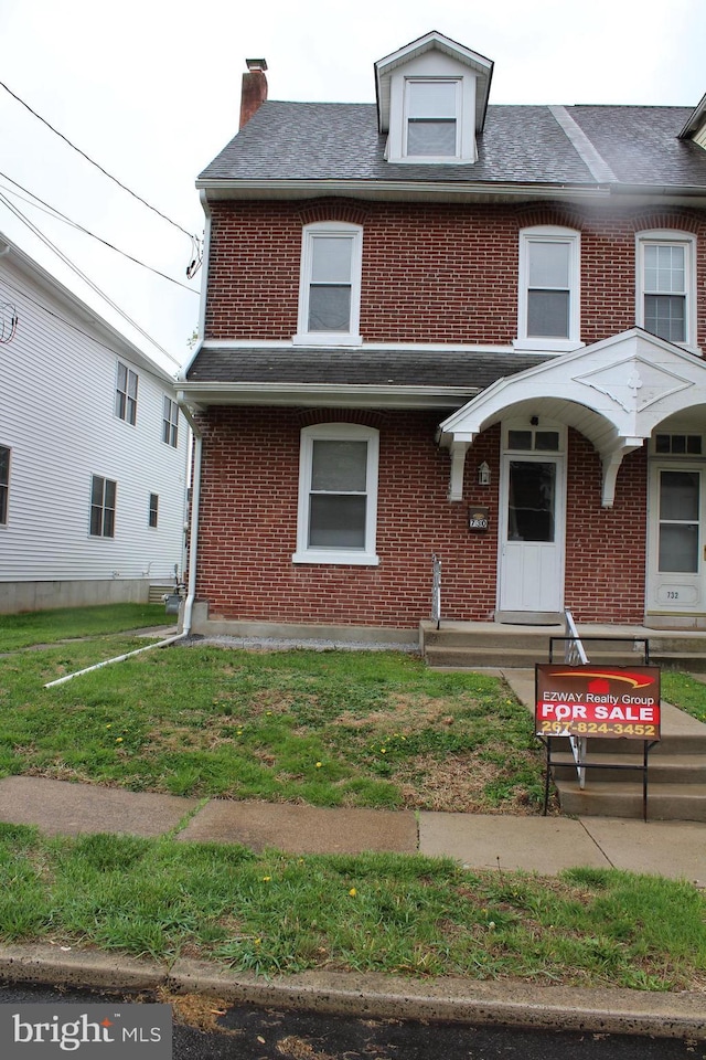 730 Third, Lansdale, PA 19446 - multi unit property with brick siding, a front lawn, and a chimney