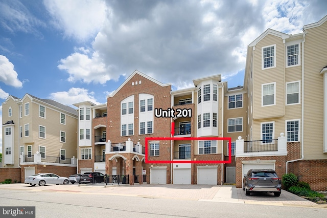 8603 Wintergreen Ct Unit 201, Odenton, MD 21113 - view of property with driveway and a garage