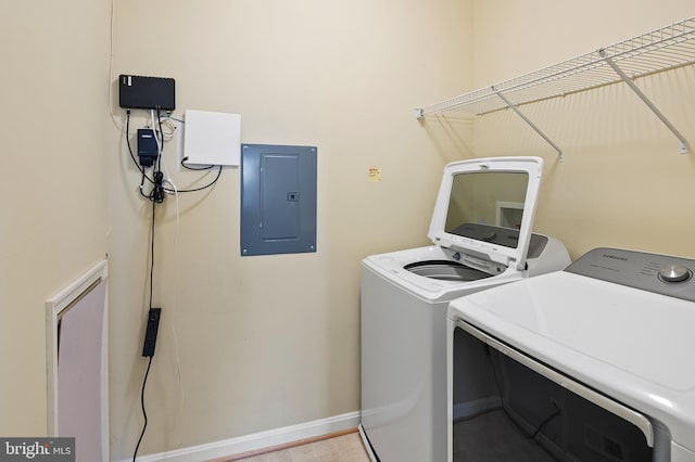 8603 Wintergreen Ct Unit 201, Odenton, MD 21113 - laundry room featuring electric panel, independent washer and dryer, and baseboards