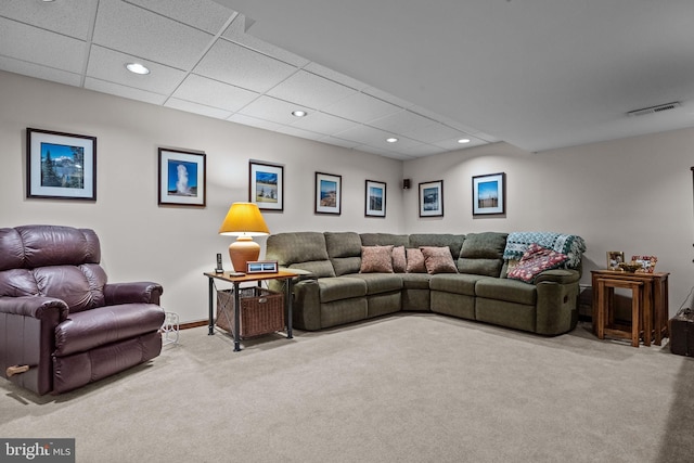 carpeted living area with a paneled ceiling, baseboards, visible vents, and recessed lighting
