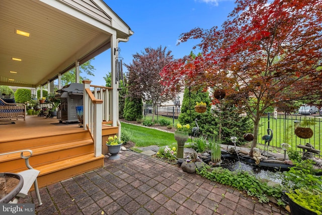 view of patio featuring fence