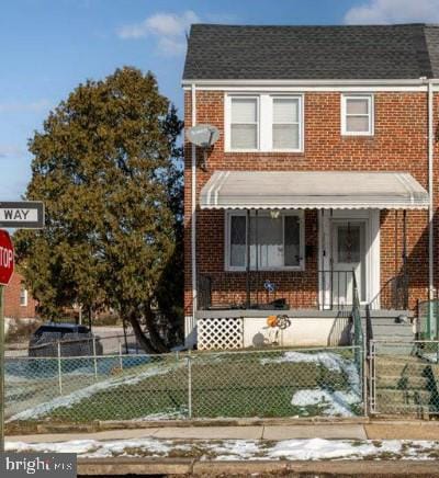 5359 Gist Ave, Baltimore, MD 21215 - view of property featuring brick siding and a fenced front yard