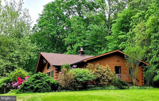5925 Huntingtown Rd, Huntingtown, MD 20639 - cabin featuring log exterior, a chimney, and a front yard