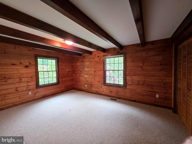 5925 Huntingtown Rd, Huntingtown, MD 20639 - unfurnished room featuring a healthy amount of sunlight, beamed ceiling, carpet flooring, and visible vents