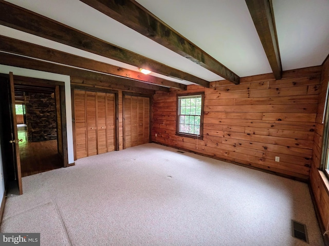 5925 Huntingtown Rd, Huntingtown, MD 20639 - interior space with wooden walls, beamed ceiling, visible vents, and carpet flooring