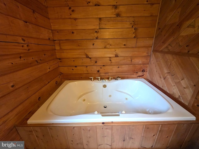 5925 Huntingtown Rd, Huntingtown, MD 20639 - bathroom featuring wooden walls and a jetted tub