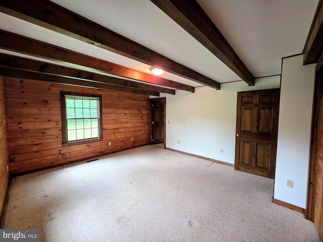 5925 Huntingtown Rd, Huntingtown, MD 20639 - unfurnished room with baseboards, carpet floors, wood walls, and beam ceiling