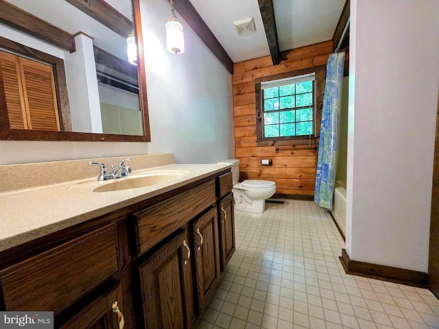 5925 Huntingtown Rd, Huntingtown, MD 20639 - bathroom featuring visible vents, shower / bath combo with shower curtain, vanity, toilet, and wooden walls