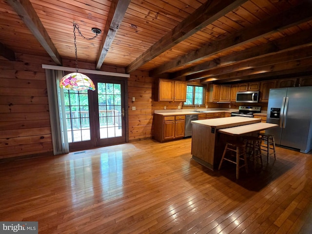 5925 Huntingtown Rd, Huntingtown, MD 20639 - kitchen with appliances with stainless steel finishes, a sink, beam ceiling, light countertops, and light wood-style flooring