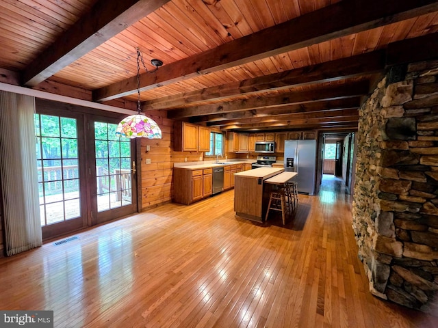 5925 Huntingtown Rd, Huntingtown, MD 20639 - kitchen featuring stainless steel appliances, visible vents, beam ceiling, and light wood-style floors