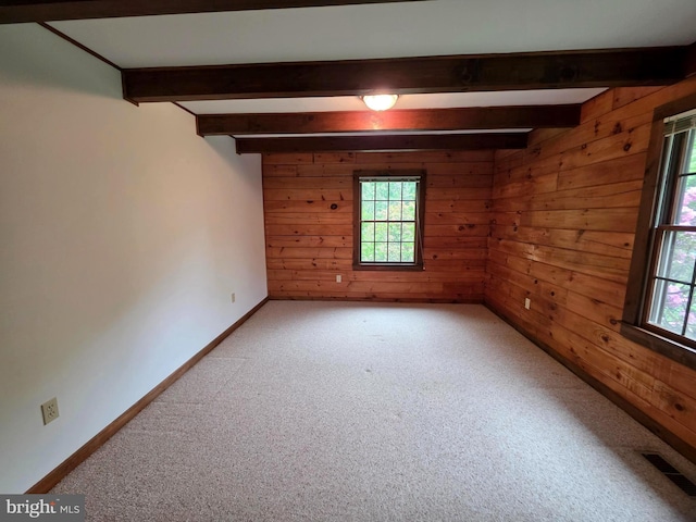 5925 Huntingtown Rd, Huntingtown, MD 20639 - empty room featuring wooden walls, beamed ceiling, and a healthy amount of sunlight
